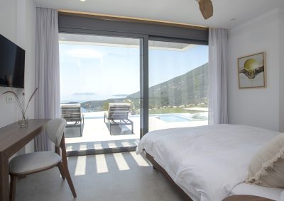 Refined bedroom with king-size bed and balcony access
