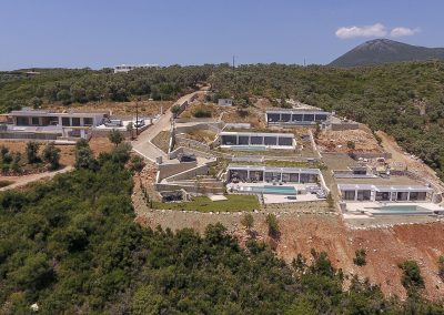 Luxury villa pool deck with loungers overlooking the Ionian horizon
