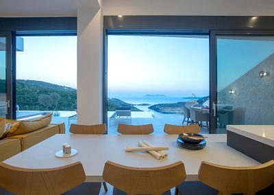 Modern hillside villa in Nikiana with outdoor lounge and sea-facing pool