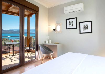 Elegant open-plan living room in luxury Lefkada villa with panoramic sea views