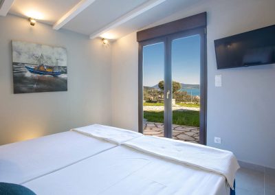 Elegant open-plan living room in luxury Lefkada villa with panoramic sea views