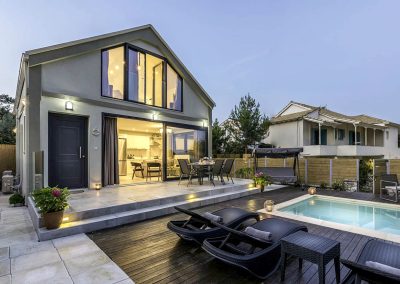 Luxury Ammousa villa exterior with spacious sun deck and crystal pool