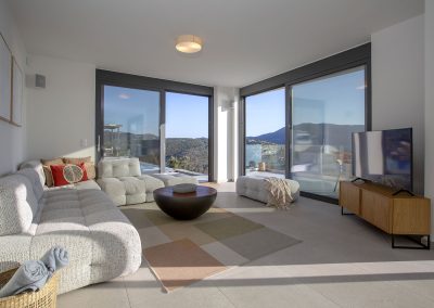 Sophisticated villa lounge in Ammousa with floor-to-ceiling windows