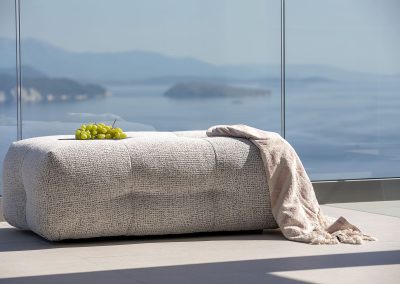 Elevated infinity pool terrace at Nikiana villa with panoramic coastline views