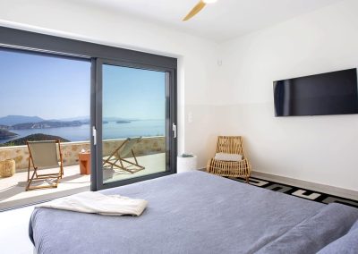 Sophisticated villa lounge in Ammousa with floor-to-ceiling windows