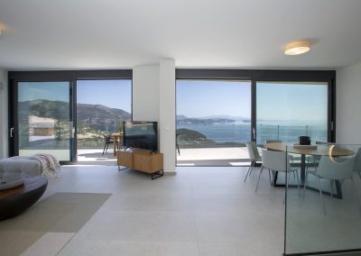 Sophisticated villa lounge in Ammousa with floor-to-ceiling windows