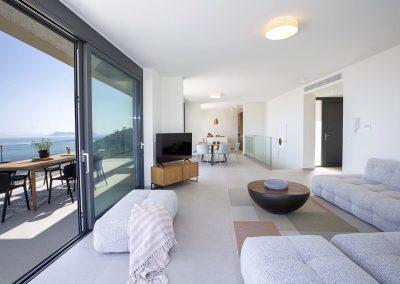 Sophisticated villa lounge in Ammousa with floor-to-ceiling windows