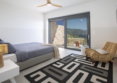 Sophisticated villa lounge in Ammousa with floor-to-ceiling windows