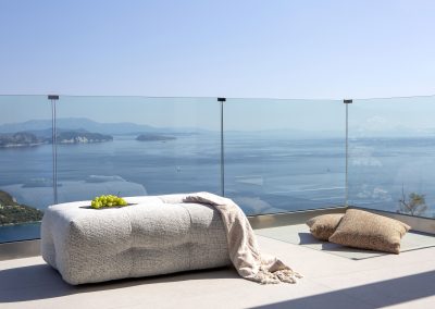 Bright open-space villa interior in Nikiana with panoramic glass walls
