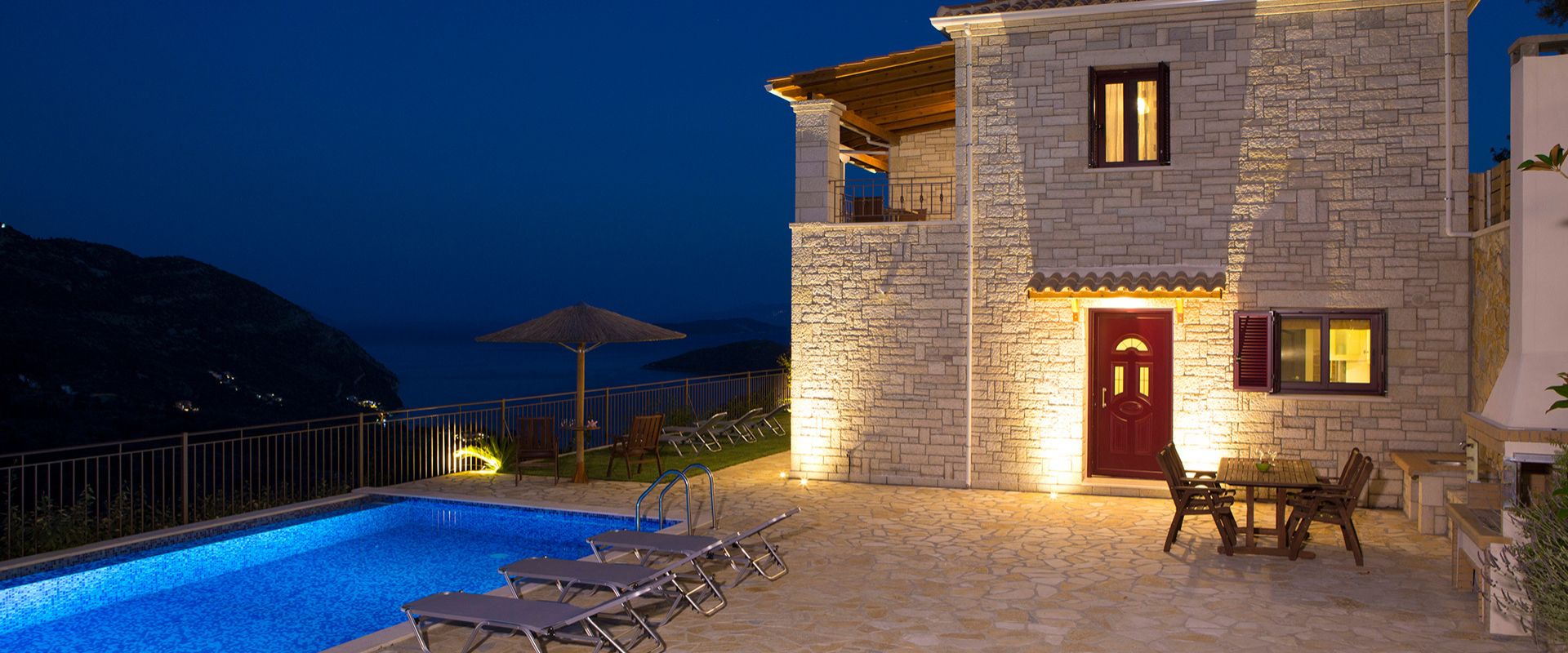 Premium Lefkada villa exterior with panoramic sea views and sun loungers