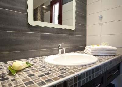 Spacious luxury bedroom suite with sea-facing balcony in Nikiana villa