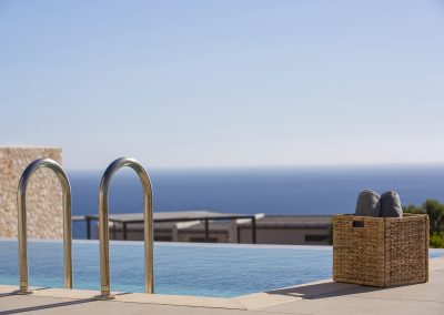 Premium Lefkada villa exterior with panoramic sea views and sun loungers
