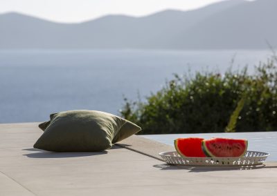 Sunset-facing pool terrace at Sivota villa with endless Ionian backdrop