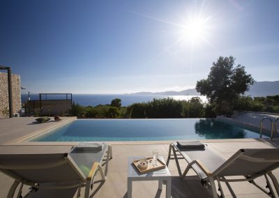 Sunset-facing pool terrace at Sivota villa with endless Ionian backdrop