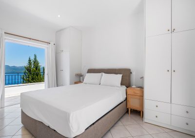 Luxury sea view master bedroom in Lefkada villa with elegant natural textures