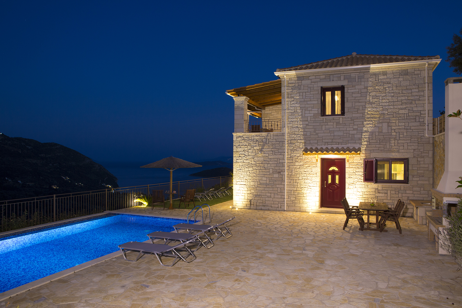 Designer overflow pool at Sivota hillside villa with endless blue sea backdrop