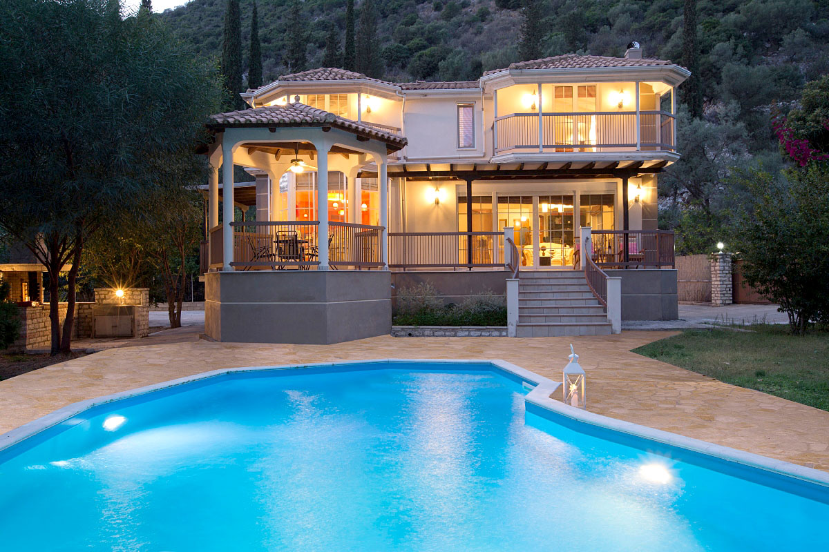 Designer overflow pool at Sivota hillside villa with endless blue sea backdrop
