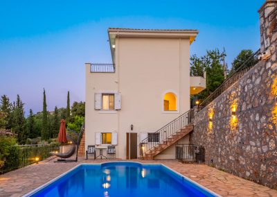 Private swimming pool with sun loungers and Ionian Sea backdrop