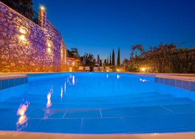 Private swimming pool with sun loungers and Ionian Sea backdrop