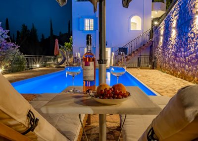 Private swimming pool with sun loungers and Ionian Sea backdrop