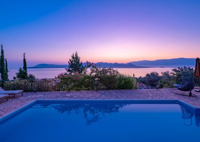 Private swimming pool with sun loungers and Ionian Sea backdrop