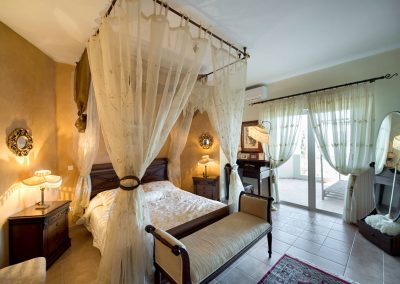 Stylish sea-facing bedroom interior in Sivota with boutique hotel aesthetics
