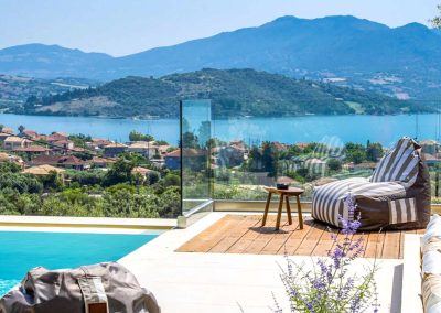Designer overflow pool at Sivota hillside villa with endless blue sea backdrop