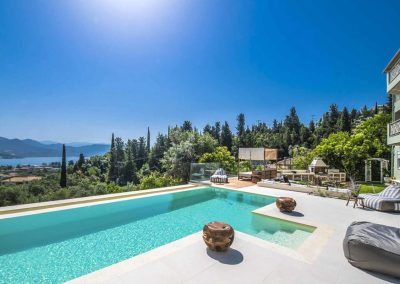 Designer overflow pool at Sivota hillside villa with endless blue sea backdrop