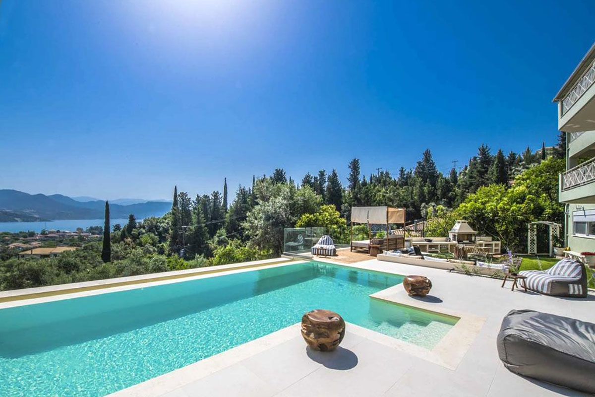 Designer overflow pool at Sivota hillside villa with endless blue sea backdrop
