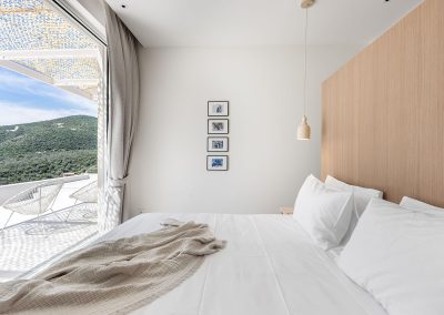 Bright ensuite bedroom in Villa Mia Rose Amousa with stylish design and relaxing coastal outlook