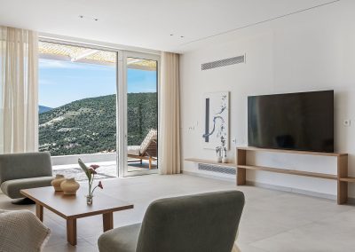 Bright open plan living area at Villa Mia Rose with modern decor and breathtaking sea views in Amousa