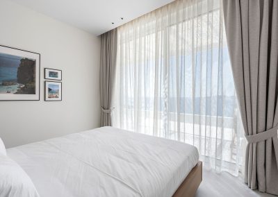 Elegant ensuite bedroom at Villa Mia Rose in Amousa Lefkada with modern decor and beautiful sea views