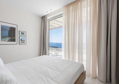 Luxury bedroom at Villa Mia Rose with refined furnishings and panoramic Ionian Sea views in Lefkada