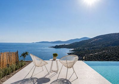 Elegant outdoor terrace at Villa Mia Rose with sun loungers, sea views and Mediterranean atmosphere