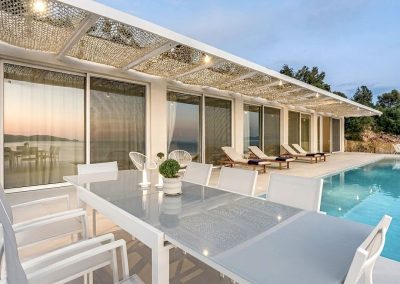 Modern villa exterior in Lefkada with private swimming pool and refined Mediterranean style